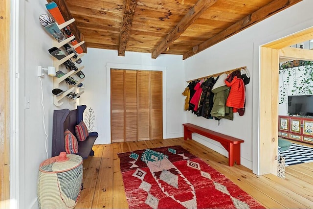 mudroom featuring wood ceiling, wood-type flooring, and beam ceiling