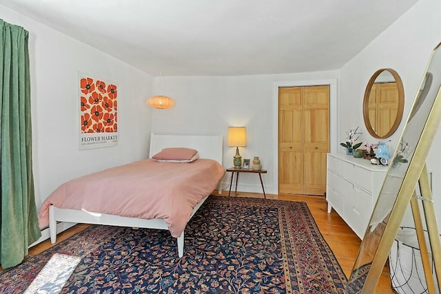 bedroom featuring light wood-style flooring