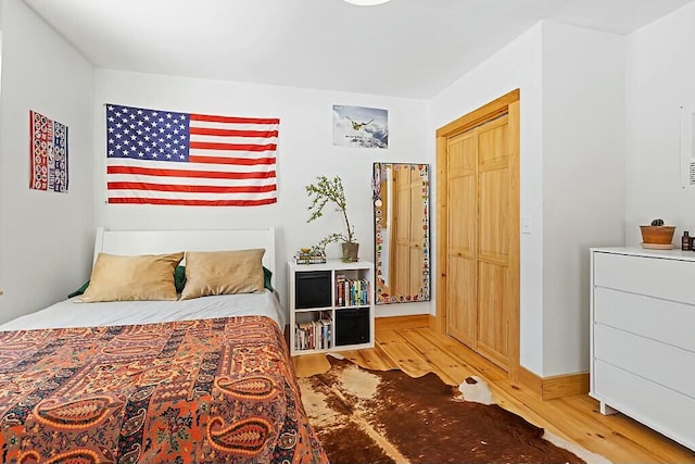 bedroom featuring wood finished floors