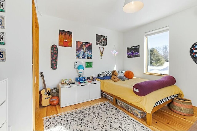 bedroom featuring light wood-style flooring