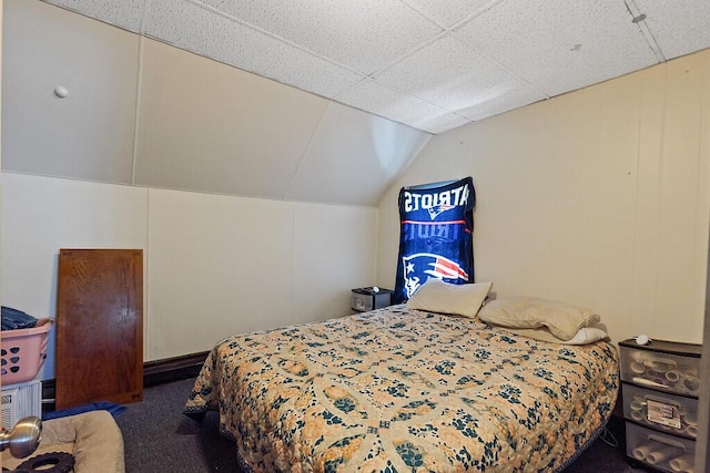 carpeted bedroom featuring vaulted ceiling