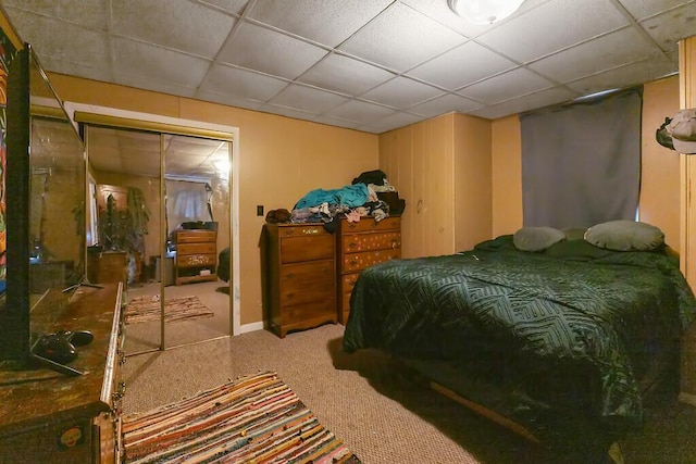 bedroom featuring a closet and a drop ceiling