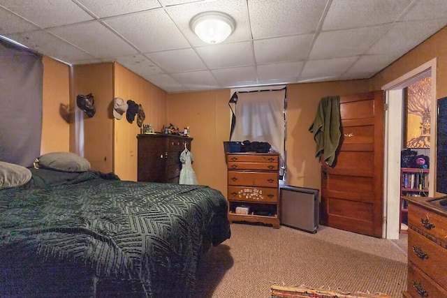 bedroom with carpet and a drop ceiling