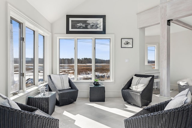 sunroom with vaulted ceiling and a wealth of natural light