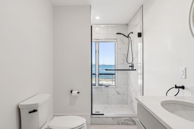 full bathroom with recessed lighting, a marble finish shower, vanity, and toilet