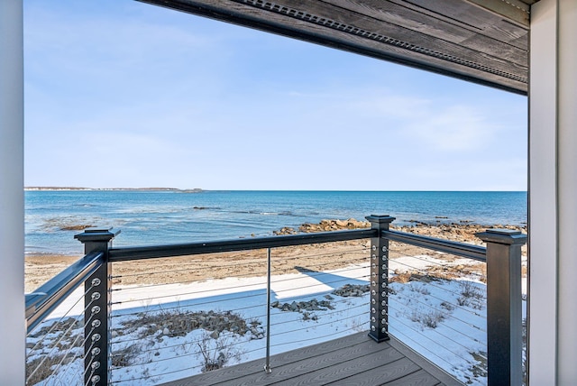 exterior space featuring a water view and a view of the beach