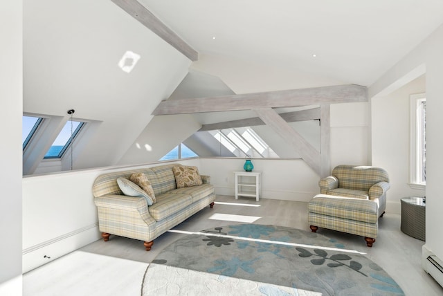 living area with vaulted ceiling with skylight, a baseboard radiator, and wood finished floors