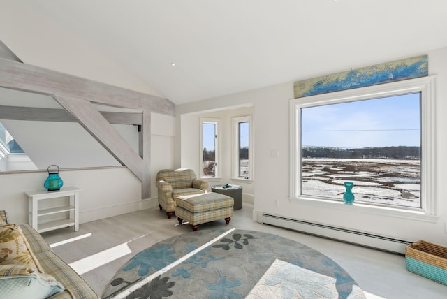 sitting room featuring a baseboard radiator and lofted ceiling