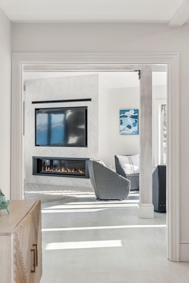 living room with a glass covered fireplace