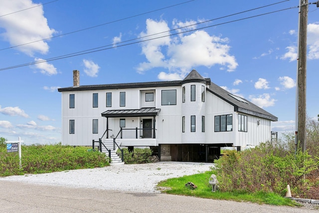 107 Marshall Point Rd, Kennebunkport, ME 04046 - view of front of property featuring a standing seam roof, a chimney, board and batten siding, and metal roof