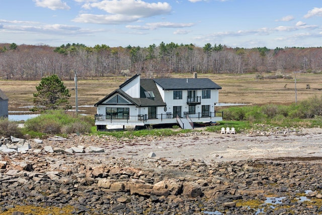 107 Marshall Point Rd, Kennebunkport, ME 04046 - view of front of property featuring a wooden deck and a view of trees