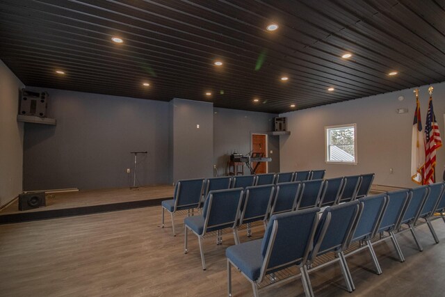 home theater room with recessed lighting and wood finished floors