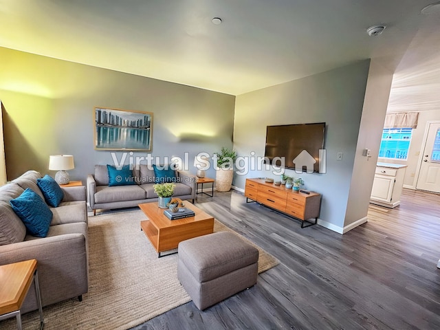 living room with baseboards and wood finished floors