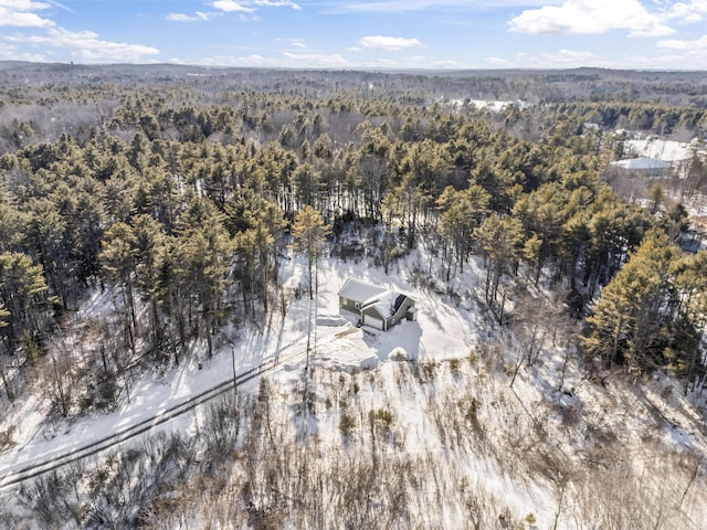 birds eye view of property featuring a view of trees