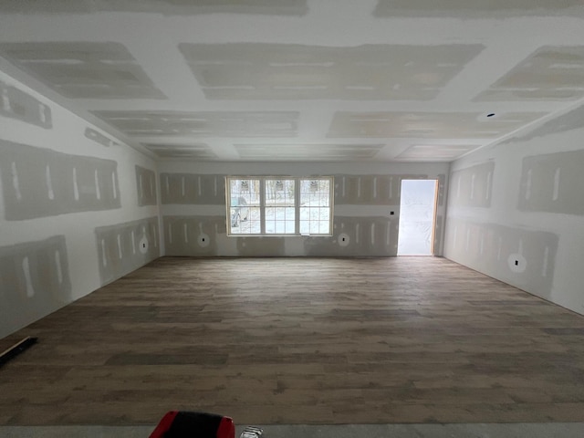 unfurnished living room with wood finished floors