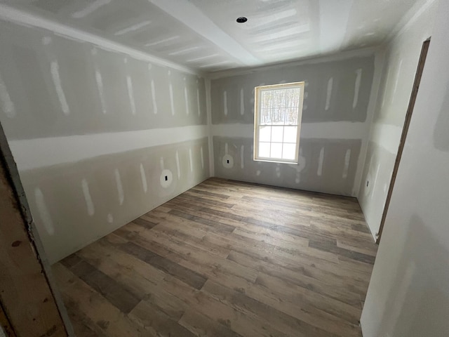 empty room featuring wood finished floors