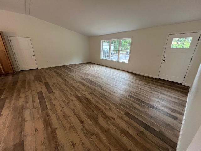 128 Main Street Hl, Dexter, ME 04930 - unfurnished living room featuring vaulted ceiling, dark wood finished floors, and plenty of natural light