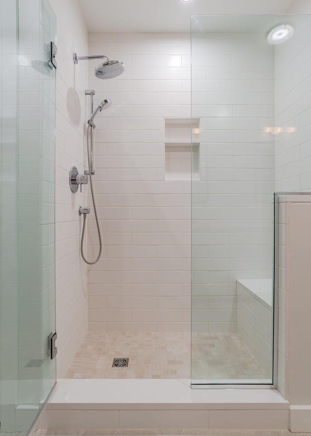 bathroom featuring a shower stall