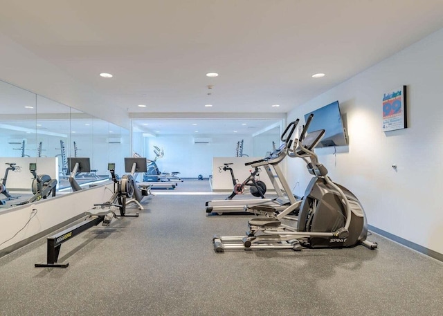 gym featuring recessed lighting and baseboards