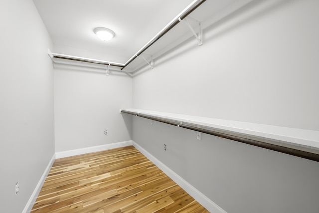 spacious closet with light wood-style floors