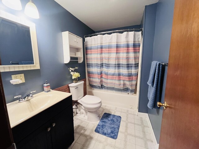 bathroom with toilet, tile patterned floors, shower / bath combo, and vanity