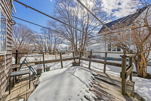 view of snow covered deck