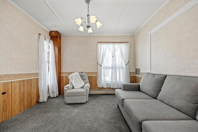 living area featuring visible vents, carpet floors, wainscoting, and a baseboard radiator