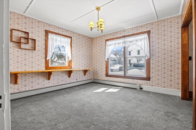 unfurnished dining area featuring carpet floors, a baseboard radiator, an inviting chandelier, and wallpapered walls