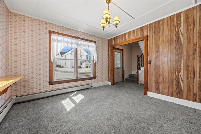 unfurnished dining area with a baseboard radiator, wallpapered walls, carpet flooring, a chandelier, and stairs