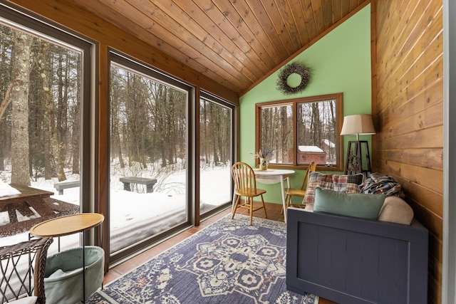 sunroom / solarium with lofted ceiling and wooden ceiling