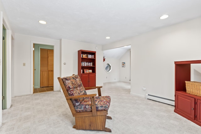 sitting room featuring light carpet, baseboards, baseboard heating, and recessed lighting