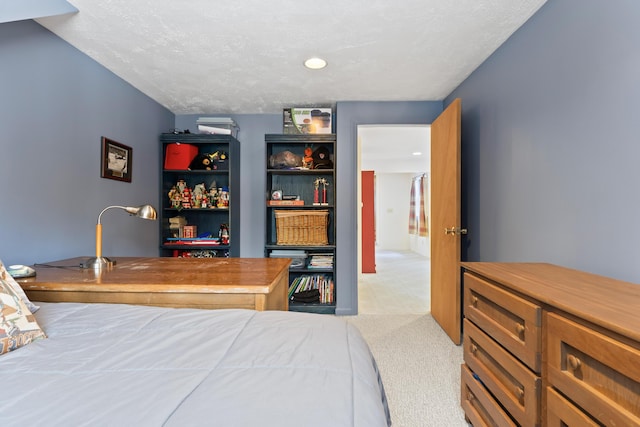 carpeted bedroom with a textured ceiling