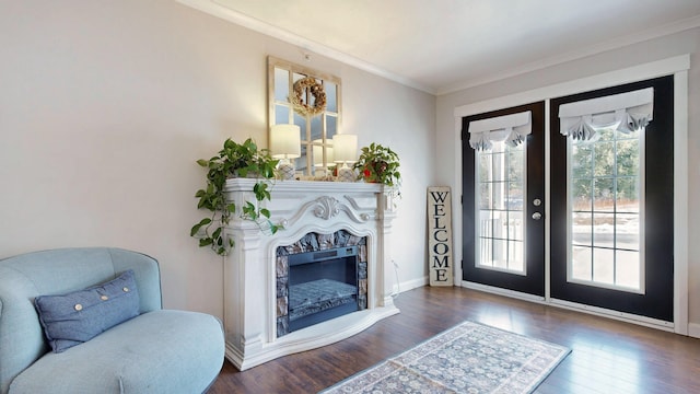 7 Dogleg Dr, Windham, ME 04062 - living area featuring french doors, healthy amount of natural light, wood finished floors, crown molding, and a fireplace