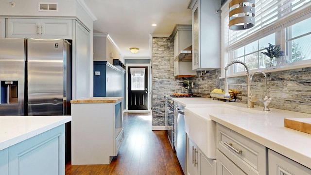 7 Dogleg Dr, Windham, ME 04062 - kitchen with stainless steel fridge, dark wood-type flooring, decorative backsplash, a sink, and wall chimney range hood