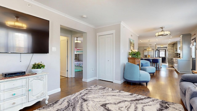 7 Dogleg Dr, Windham, ME 04062 - living area featuring dark wood finished floors, ornamental molding, and baseboards