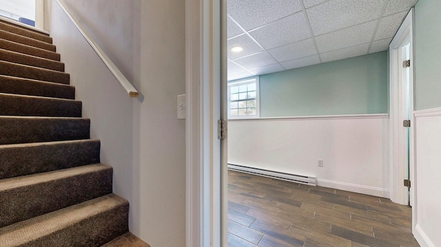 7 Dogleg Dr, Windham, ME 04062 - stairway with a baseboard heating unit, wood finished floors, a paneled ceiling, recessed lighting, and baseboards