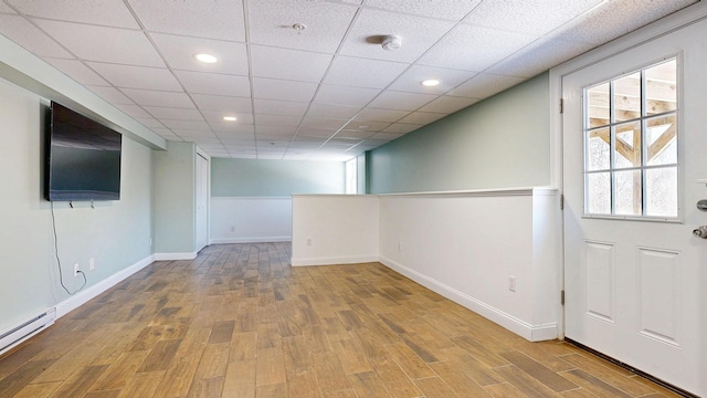 7 Dogleg Dr, Windham, ME 04062 - below grade area featuring a baseboard heating unit, wood finished floors, baseboards, recessed lighting, and a drop ceiling