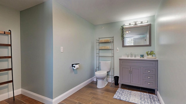 7 Dogleg Dr, Windham, ME 04062 - bathroom featuring wood finished floors, toilet, and baseboards