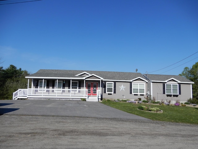 7 Dogleg Dr, Windham, ME 04062 - ranch-style house with covered porch, a front yard, french doors, and roof with shingles