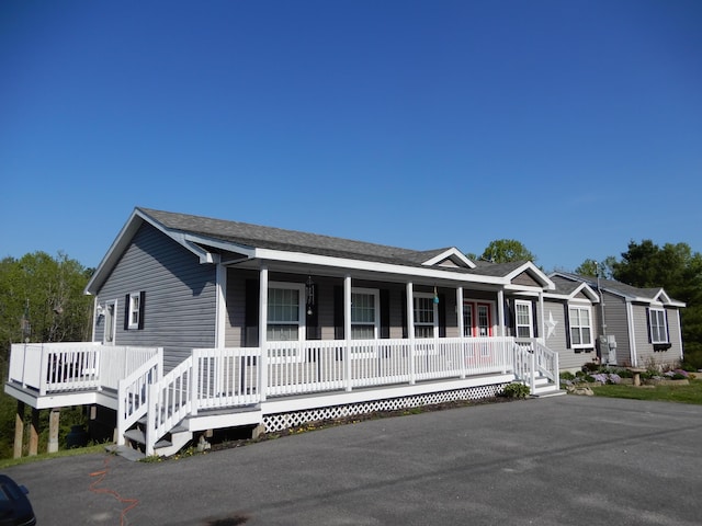 7 Dogleg Dr, Windham, ME 04062 - view of front of house featuring covered porch and roof with shingles