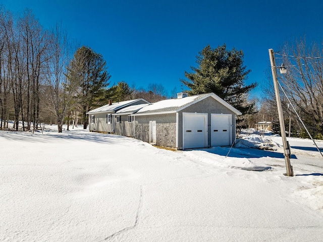 view of snow covered garage