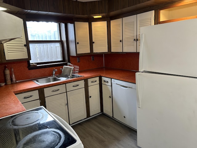 35 Bath Rd, Brunswick, ME 04011 - kitchen featuring dark countertops, wood finished floors, white appliances, and a sink