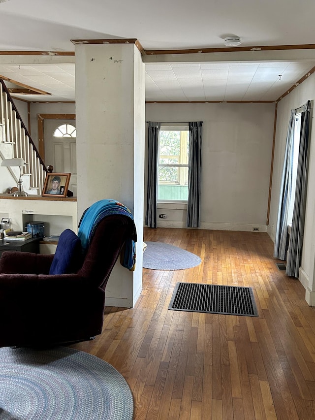 living room featuring hardwood / wood-style floors and stairway