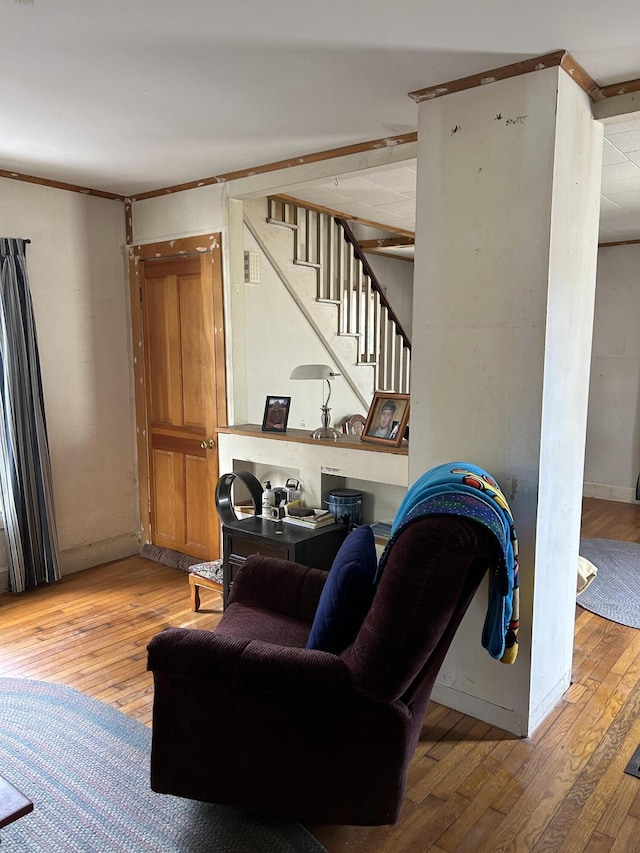 living room featuring wood-type flooring and stairs