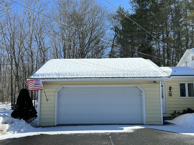 view of snow covered garage