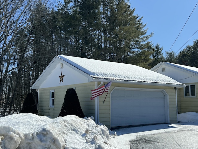 view of snow covered garage