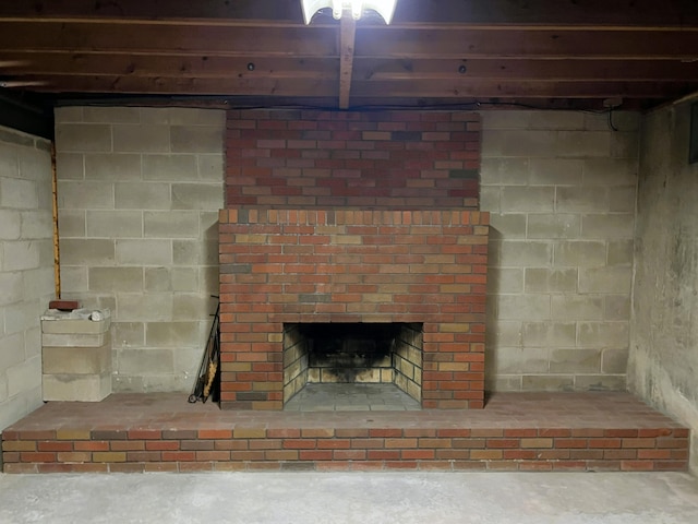 interior details with concrete floors and a fireplace