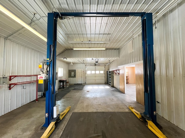 garage with electric panel and metal wall