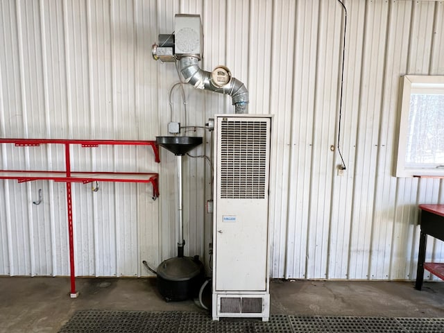 utility room featuring a heating unit