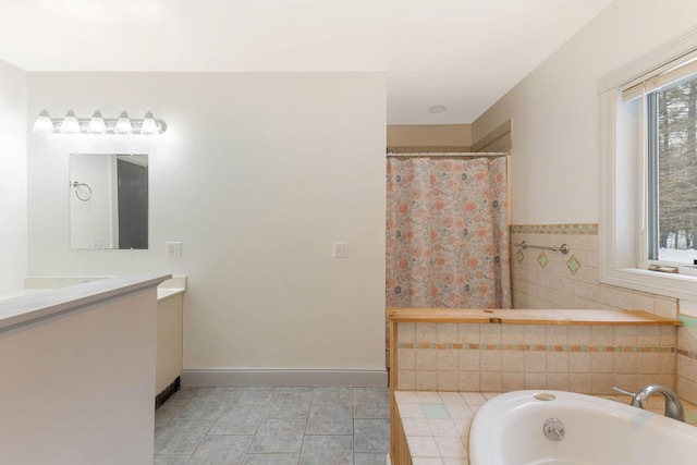 full bathroom with a shower with shower curtain, vanity, baseboards, tile patterned floors, and a tub